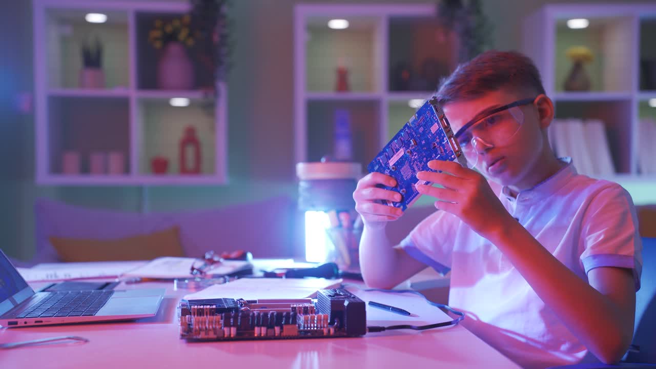 The little boy is tech savvy.