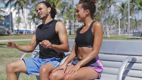 woman showing bicep to boyfriend