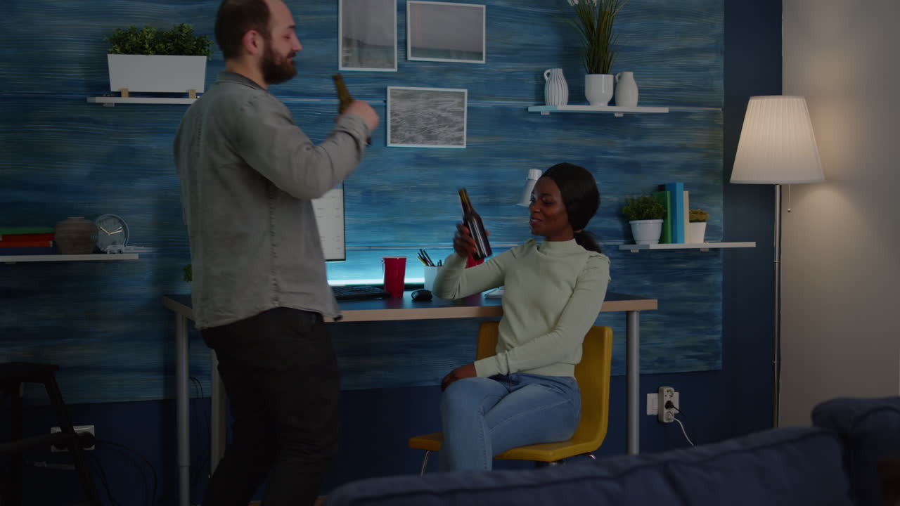 Happy man greeting his mixed race friends while talking with black woman