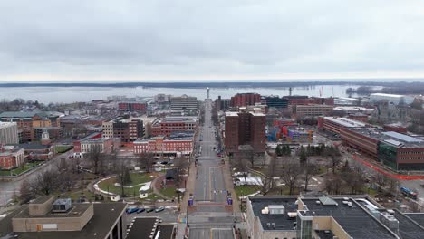 static aerial of state street in the winter in downtown erie, pa with the bayfront in the background.