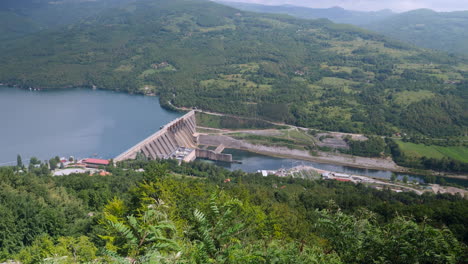 a top scenic view of a beautiful hydroelectric power plant in rich green valley