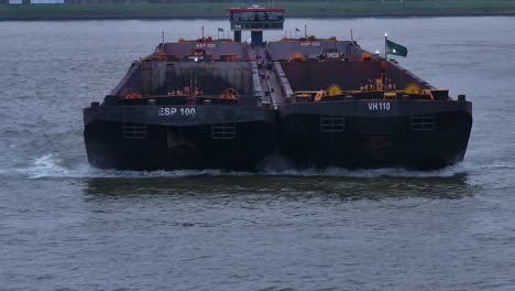 splashing water at bow of vessel captured in slow motion as boat sails onward