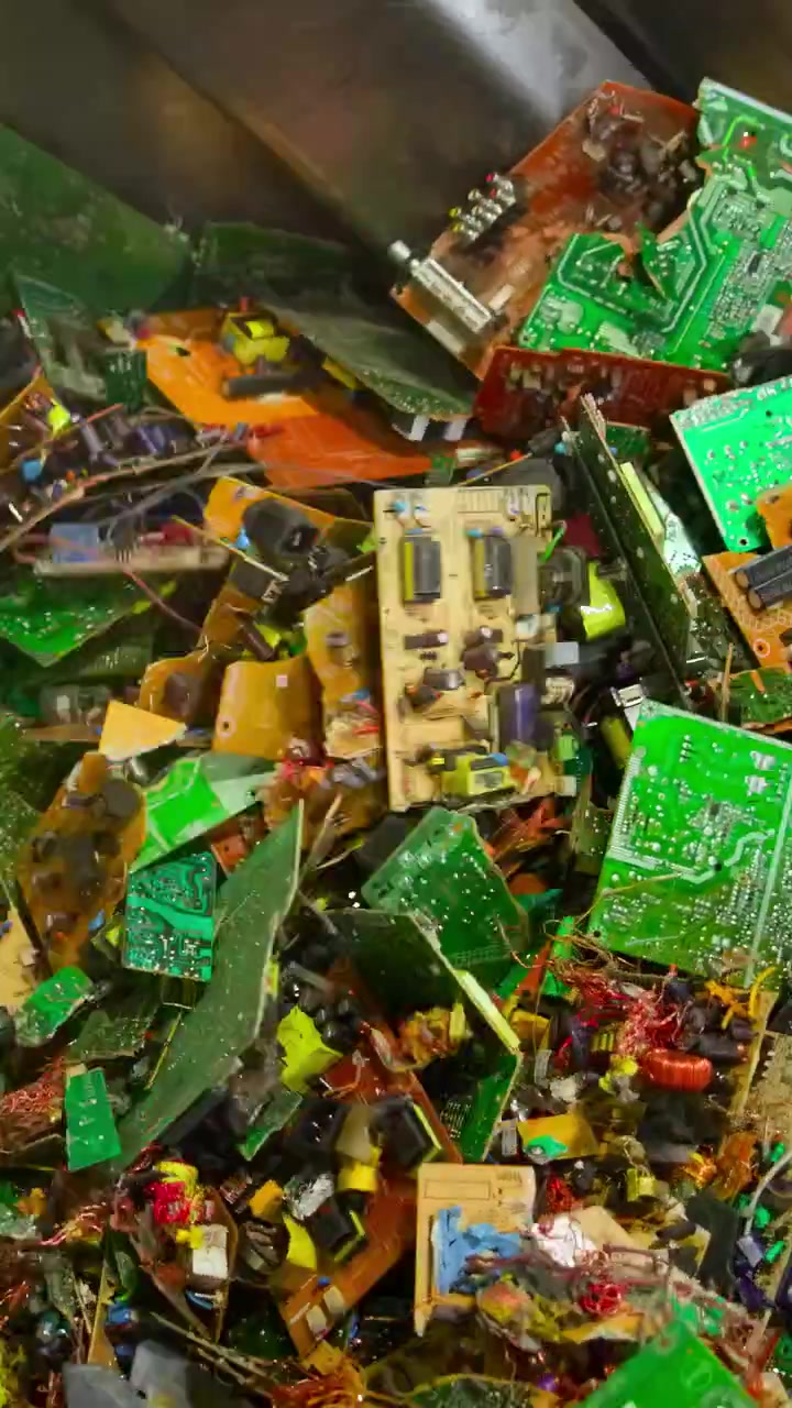 Colorful Circuit Boards In Metal Drum, Assorted Pcbs With Resistors And Capacitors Visible, Stainless Steel