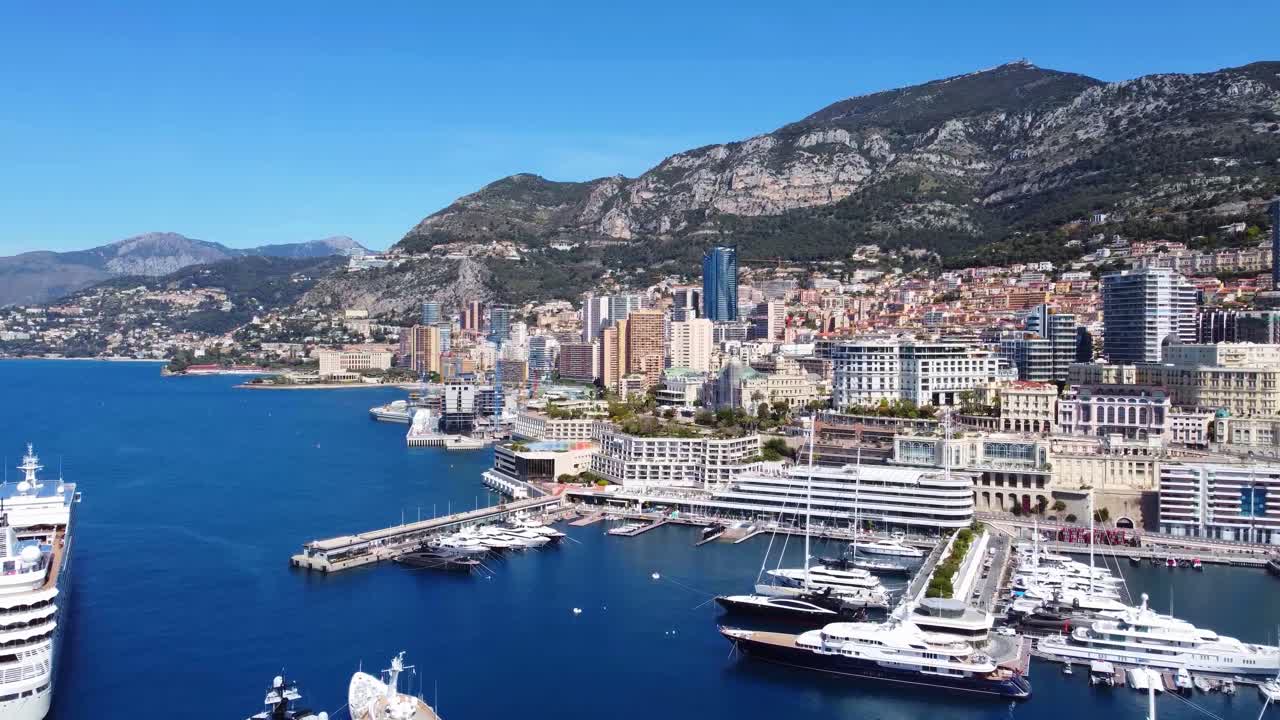 Aerial of Port Hercule, Monaco with mega yachts and skyline