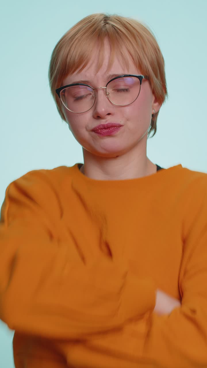 Young woman keeping arm near ear for louder voice asking to repeat to hear information deafness