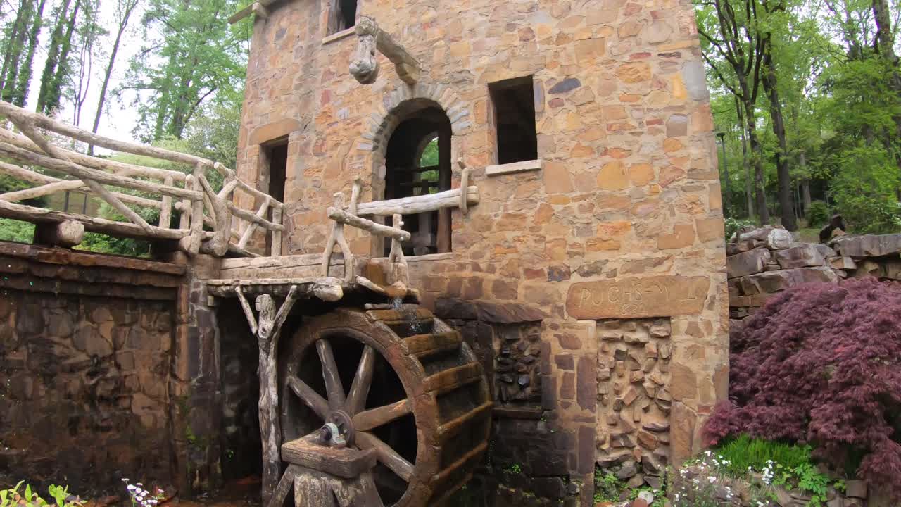 Old water mill water flowing. The Old Mill is located in the T.R. Pugh Memorial Park North Little Rock Arkansaslisted on the National Register of Historic Places