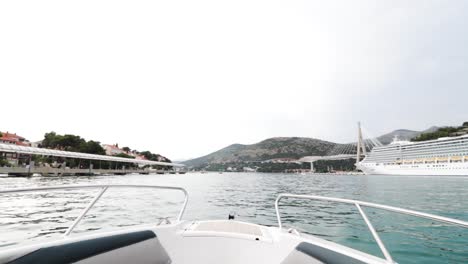 The-bow-of-a-speedboat-sailing-through-crystal-clear-water-in-Croatia