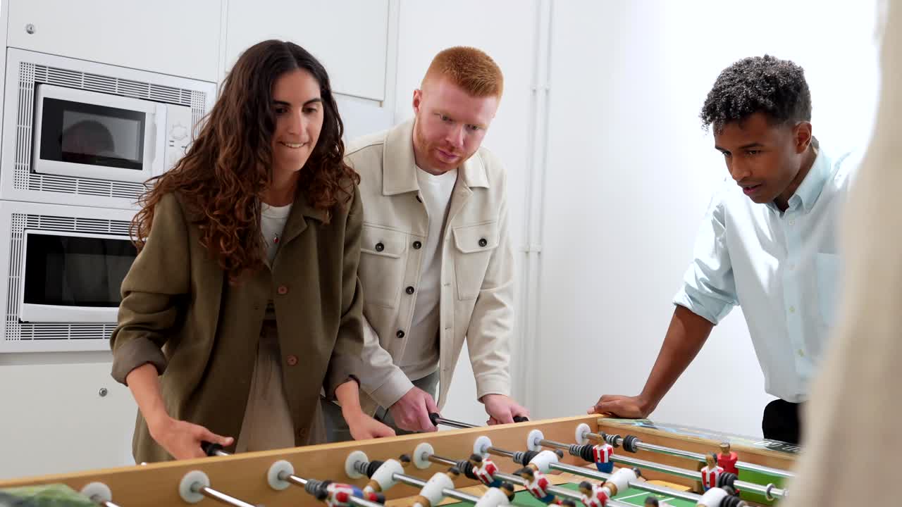People playing foosball