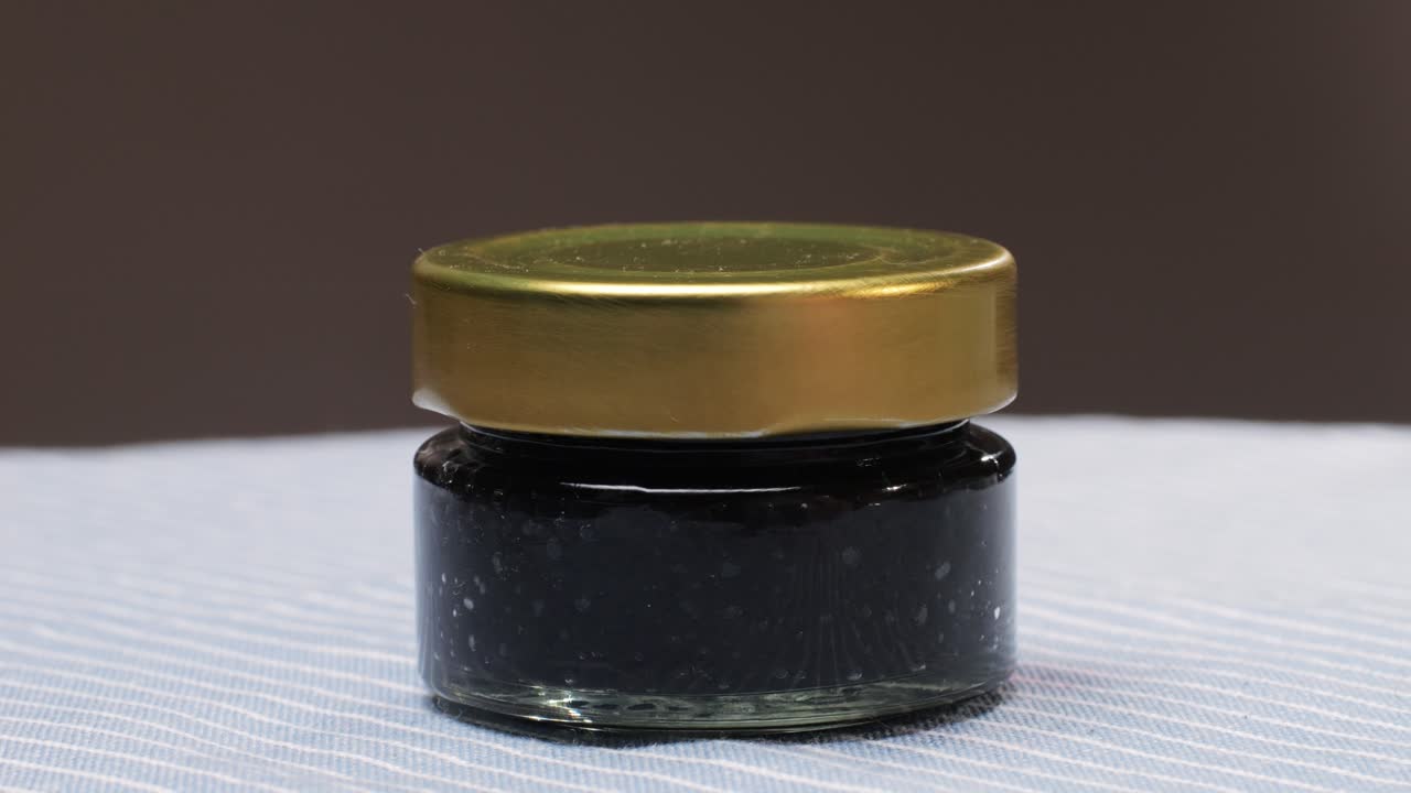 Small Glass Jar with Dark Condiment
