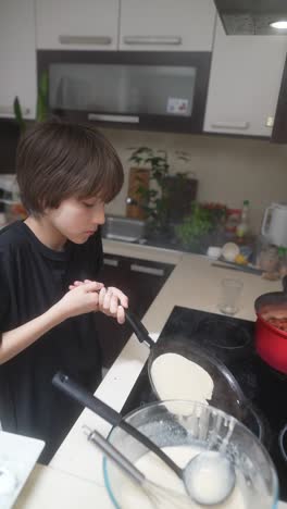boy making pancakes