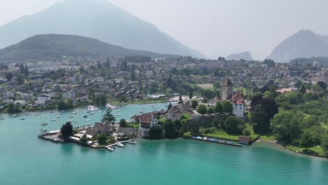 spiez town on lake thun switzerland panning drone aerial