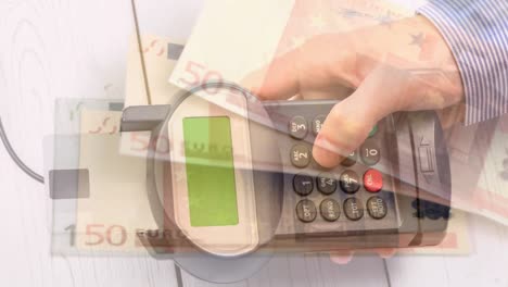 animation of euro banknotes falling over hand of caucasian man holding payment terminal