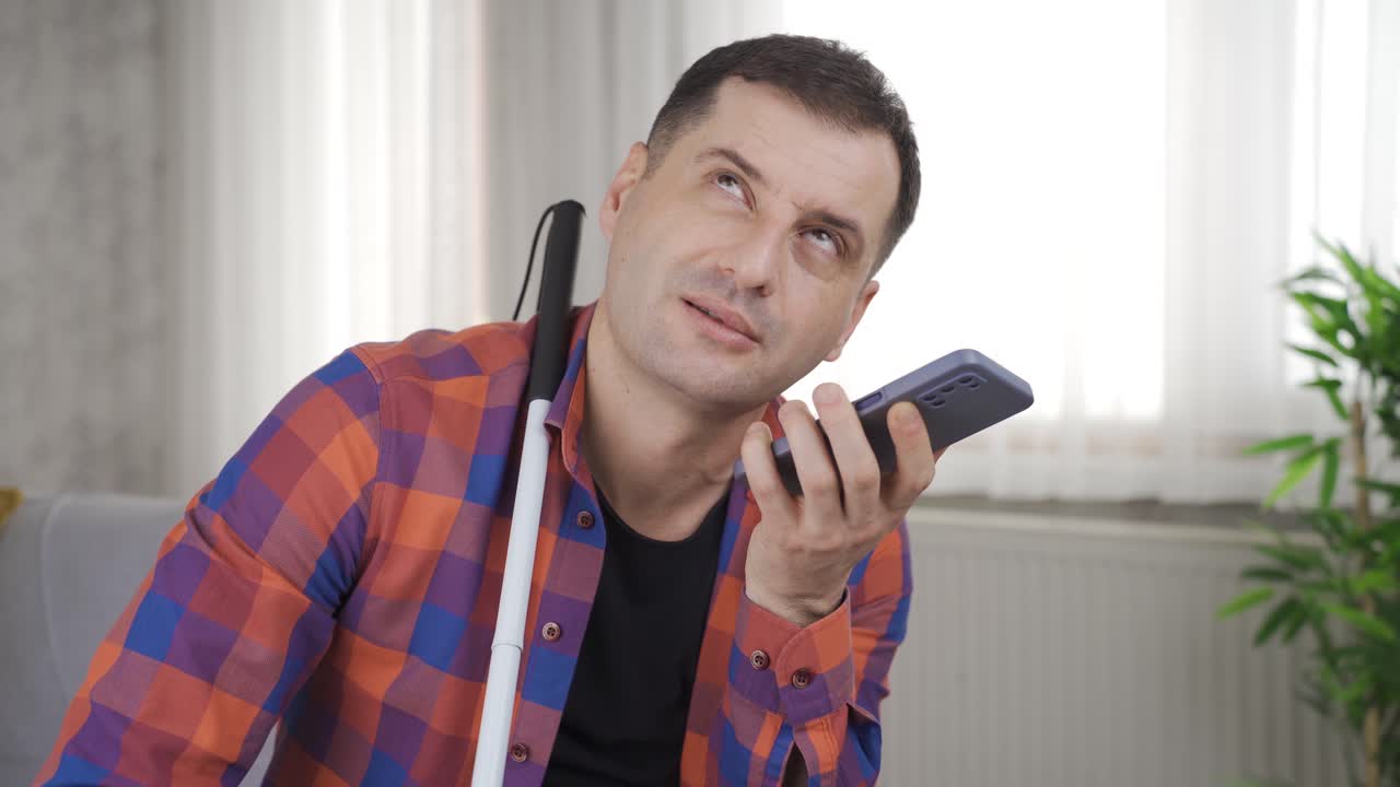 Blind man talking on the phone.