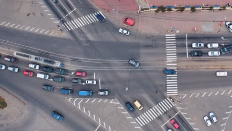 the movement of cars at a crossroads in a small town. aerial view of highway crossroads