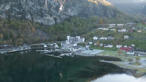 geiranger waterfront with buildings and moored boats, norway, aerial view