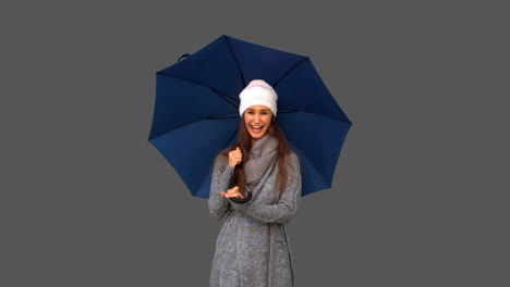 pretty young woman playing with umbrella