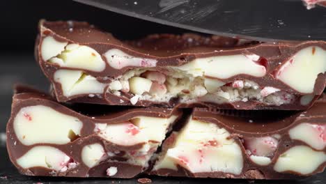 close-up of a stacked peppermint chocolate bar being cut
