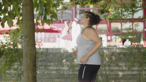 Tracking-shot-of-happy-Caucasian-women-running-outside