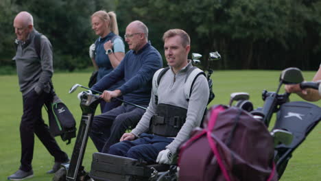 people playing golf on a golf course
