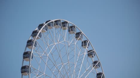 ferris wheel against a clear blue sky