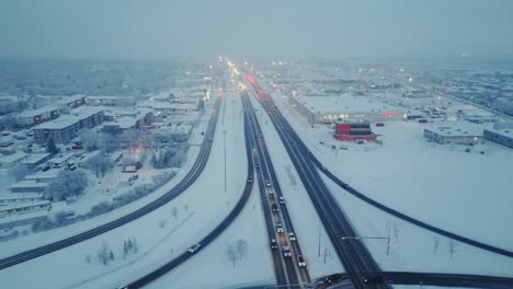 drone shot of a busy rush hour free way during a foggy winter evening