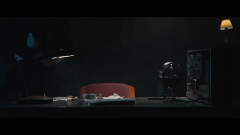 an intelligence officer sits down to the wiretap station