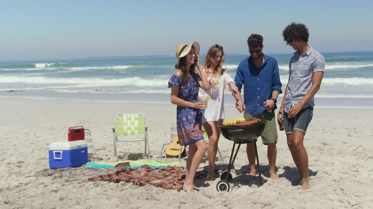 Groupe d'amis cuisinant au barbecue 4k