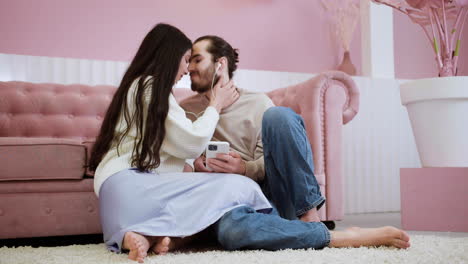 young people kissing at home