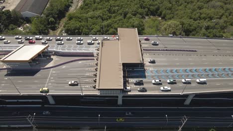 Pullback-downward-view-of-toll-gateway-in-Thailand-suspended-Highway-road