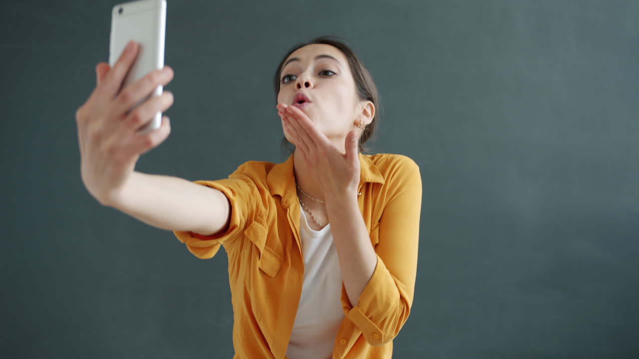 Woman taking selfies