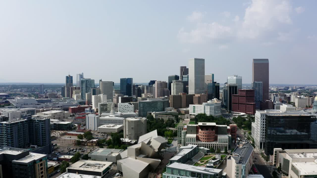 Aerial view of Denver's downtown skyscrapers surrounding the Hamilton Building