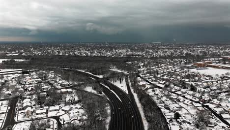 An-aerial-view-of-the-Southern-State-Parkway-on-Long-Island,-NY-on-a-cloudy-winter-day