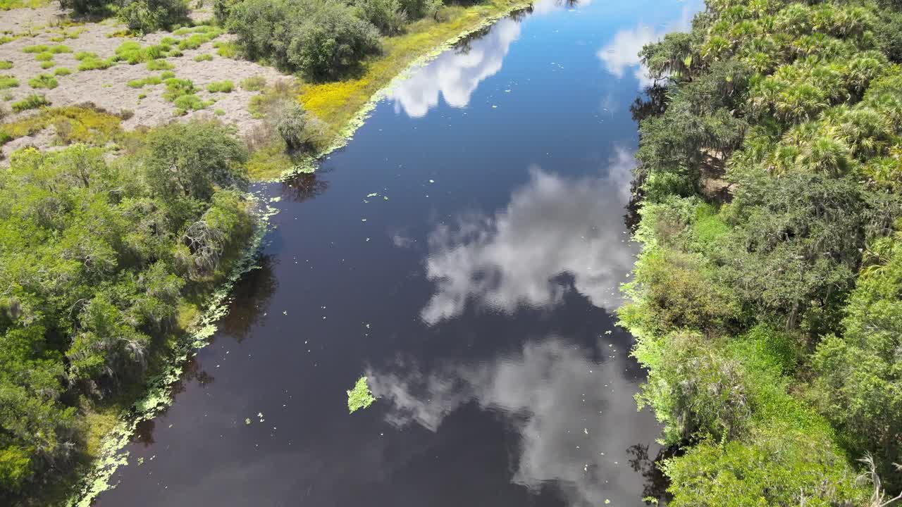 Clouds reflect off of the Myakka River, in Myakka River State Park, near Sarasota and Bradenton, Florida