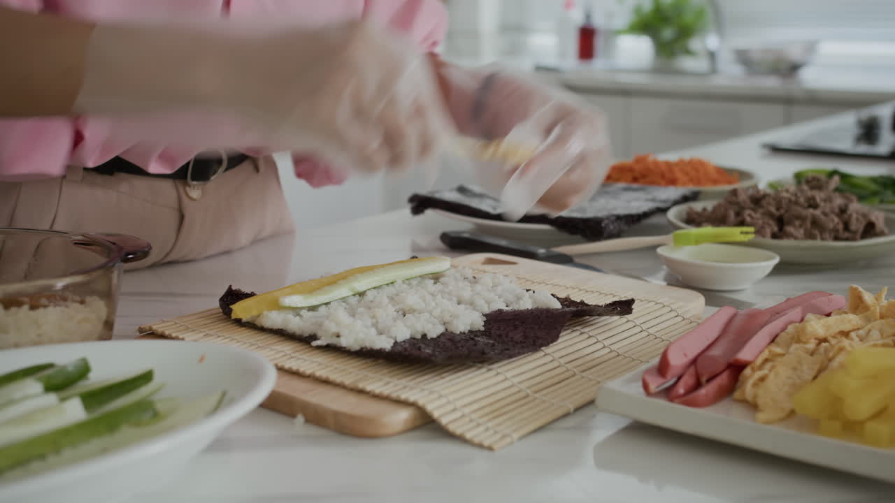 Girl Preparing Traditional Asian Gimbap at Kitchen