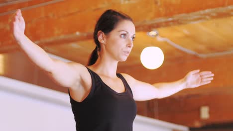 Woman-performing-stretching-exercise