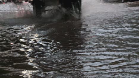 traffic lights reflected in the city flood water