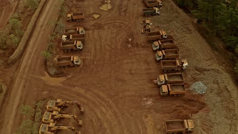 rows of dump trucks and excavators at the taganito mining site in claver philippines