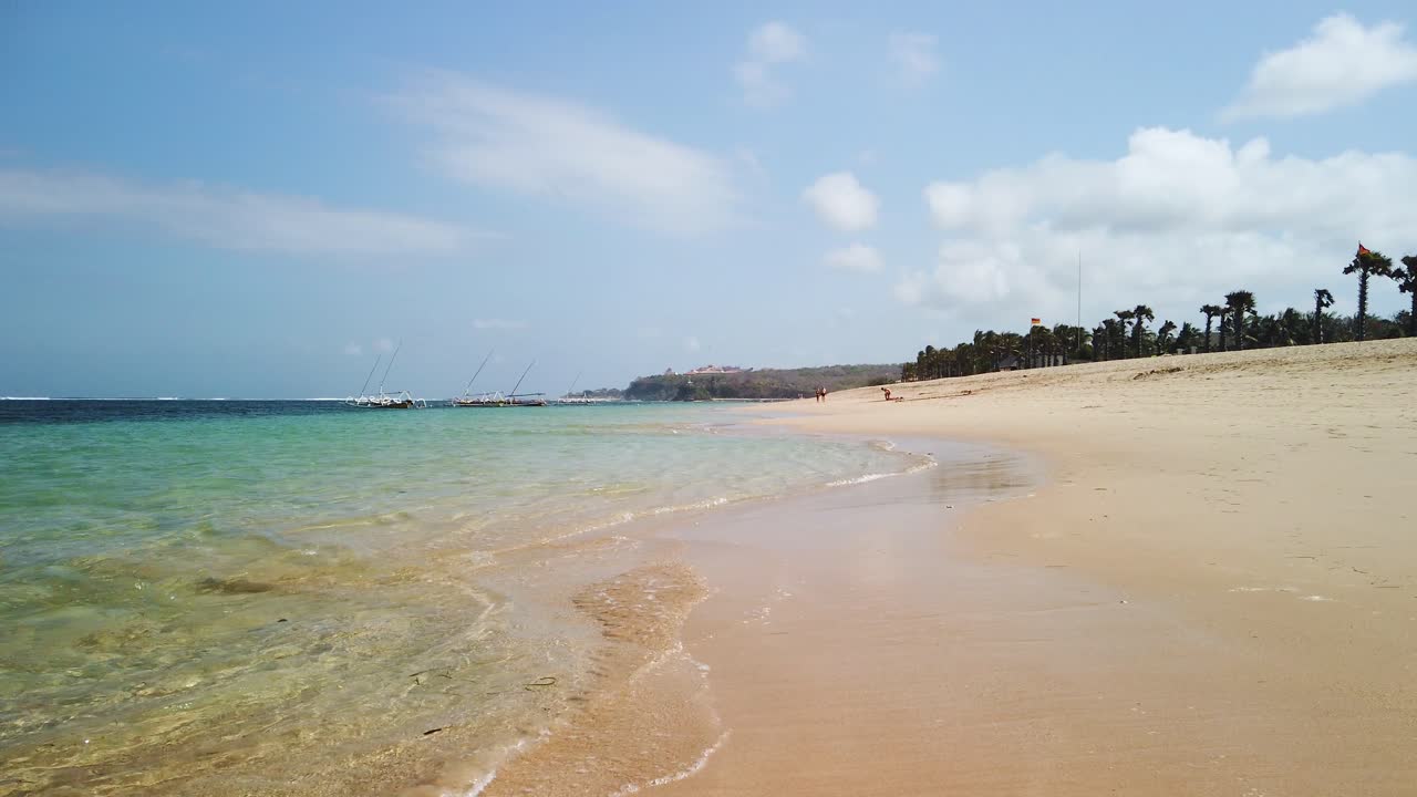 Turquoise beautiful Bali Indonesia destination. Beautiful tropical beach amazing location and getaway tourist adventure destination. Sunny day with beautiful ocean view and sandy beach