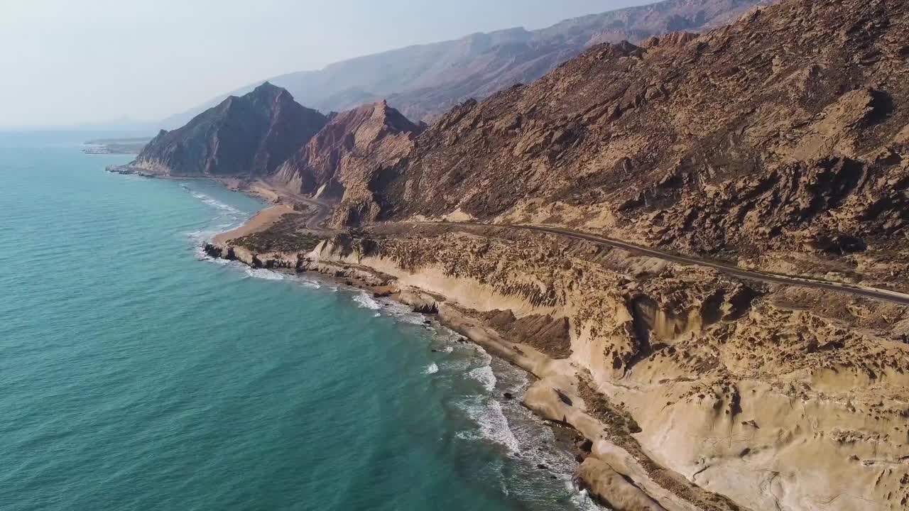 flight over sea the landscape of coast beach shore rocky mountain nature tropical climate view campsite near the sea luxury resort water sport marine adventure trip to Qatar Iran border Island Hormuz