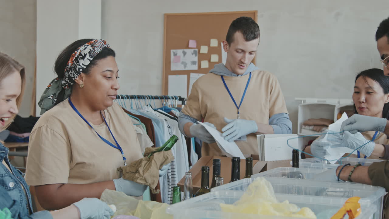 Volunteers Sorting Garbage in Recycling Containers