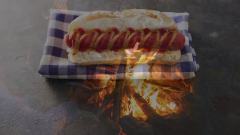 Animation-Einer-Flamme-über-Hot-Dog-Und-Tuch