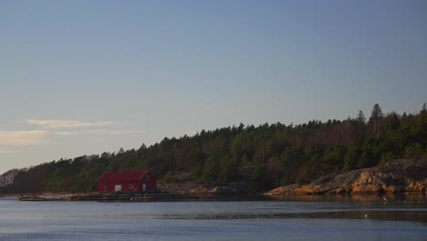 sandefjord nötholmens naturreservat strömstad marina red building seagull birds coastal seaside town stromstad sweden sverige ferry boat norge scandinavia arctic golden hour sunset coastline static
