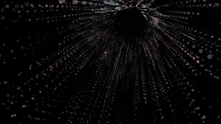 Abstract spreading multi colored glowing particles in three dimensional space. 4k Resolution.