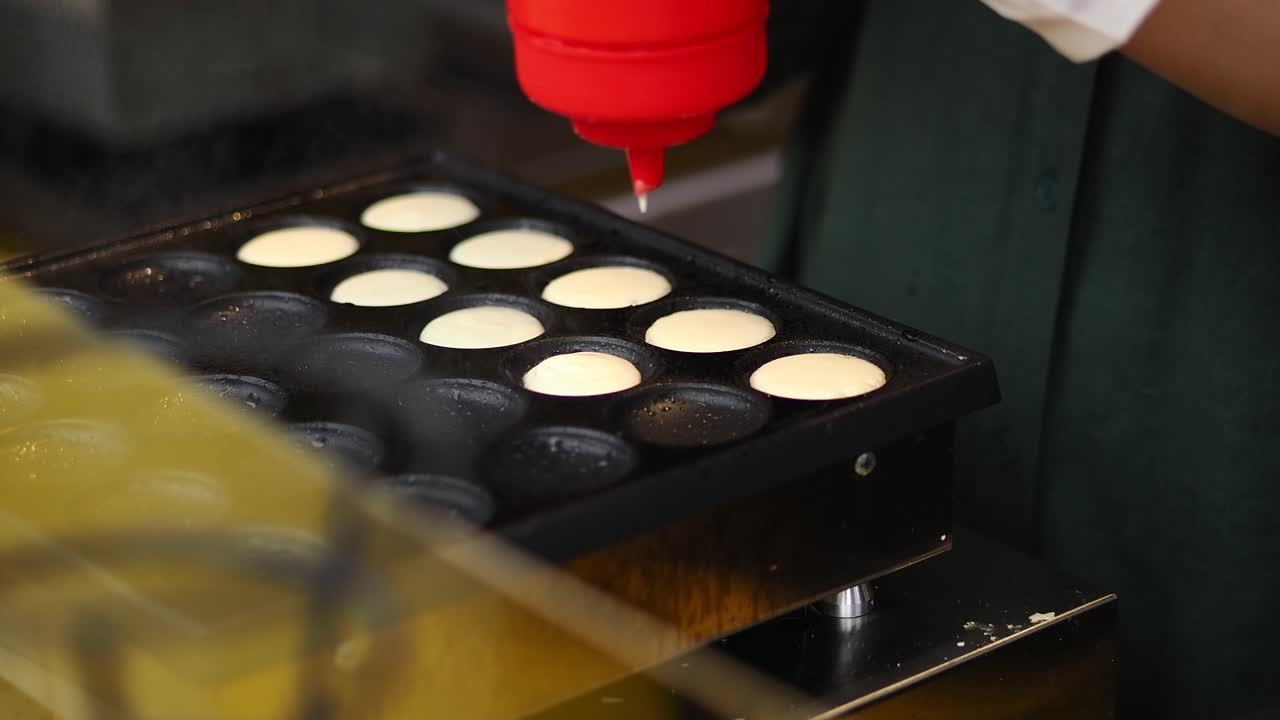 Chef Pouring Batter into Mini Pancake Griddle