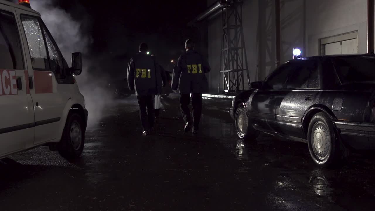 FBI Agents Investigating a Crime Scene at Night