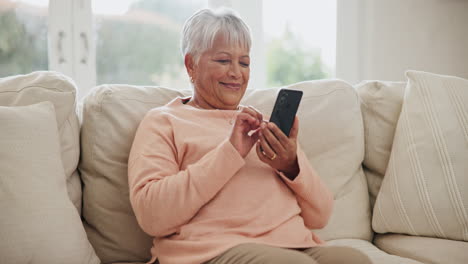 senior woman, smartphone and house on living room