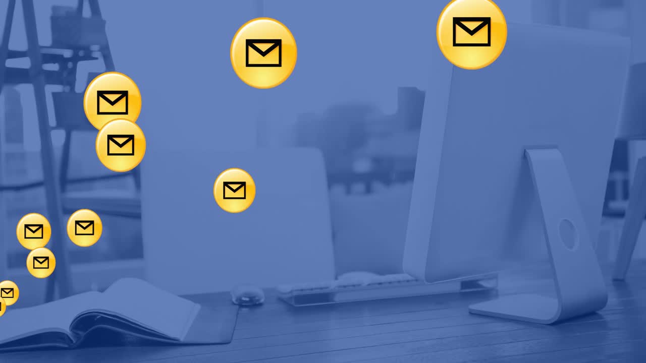 Animation of network of email icons over computer in office