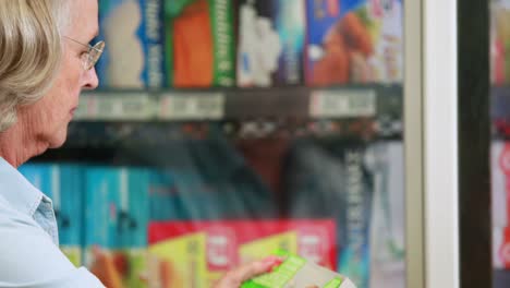 senior woman shopping in grocery store