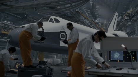 engineers working on a space shuttle in an advanced industrial hangar
