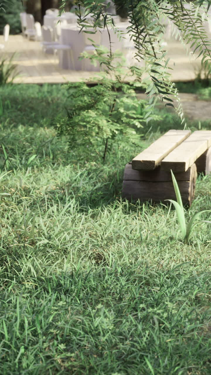 Wooden blocks resting on a small stand in the grass during daytime